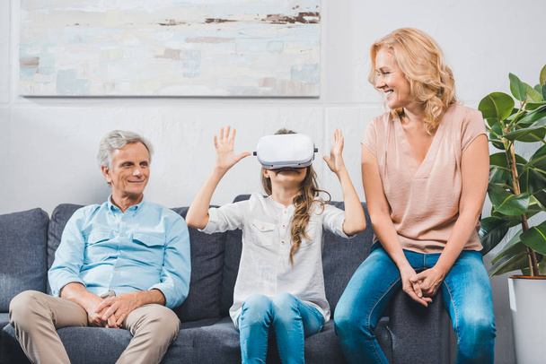 granddaughter using virtual reality headset - Valokuva, kuva