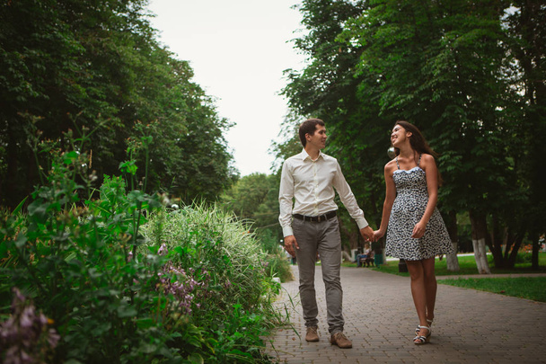 Beautiful young couple on a nature background - Valokuva, kuva