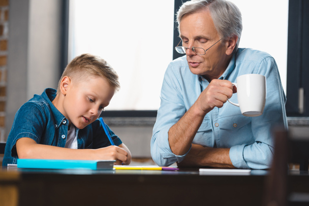 grandfather and grandson drawing together - Photo, Image