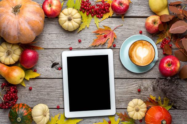 Seasonal background with autumn harvest and tablet - Fotoğraf, Görsel