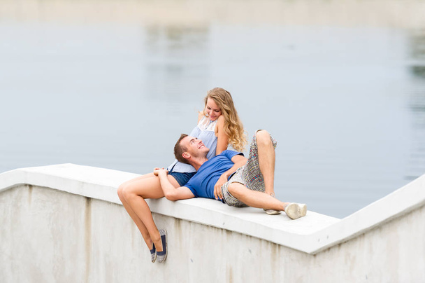 Happy young couple spending time outdoors on a summer day in a city park.  - Fotografie, Obrázek