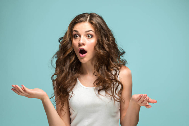 Portrait of young woman with shocked facial expression - Foto, Imagem