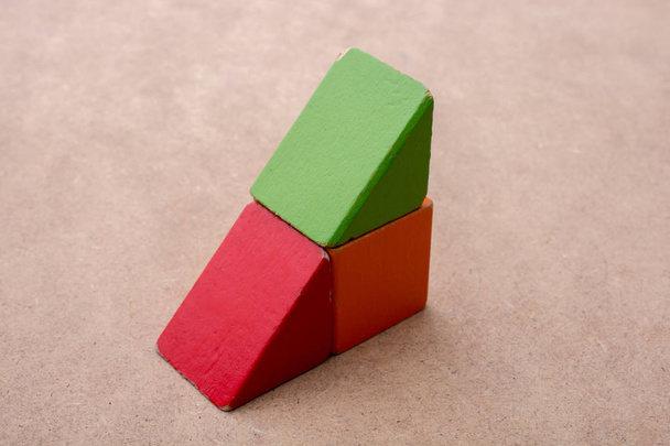 Colorful building  blocks on a brown background - Photo, Image
