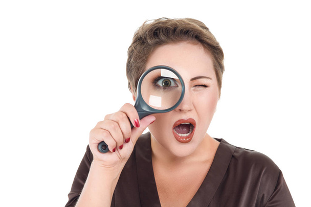 Businesswoman looking through magnifying glass - Photo, image