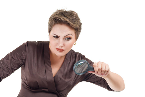 Businesswoman looking through magnifying glass - Foto, immagini