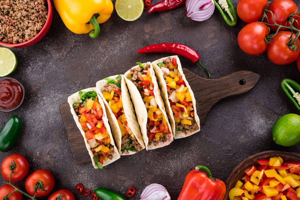 Mexican tacos with vegetables and meat. Ingredient for cooking tacos al pastor on concrete background - Photo, Image