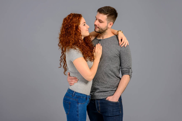 Nice young couple in the studio	 - Foto, afbeelding