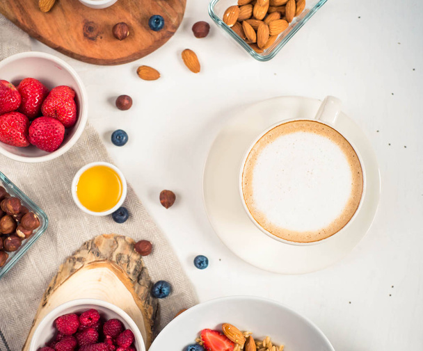 Breakfast table with oatmeal porridge, croissants, fresh fruit overhead shot - Fotografie, Obrázek