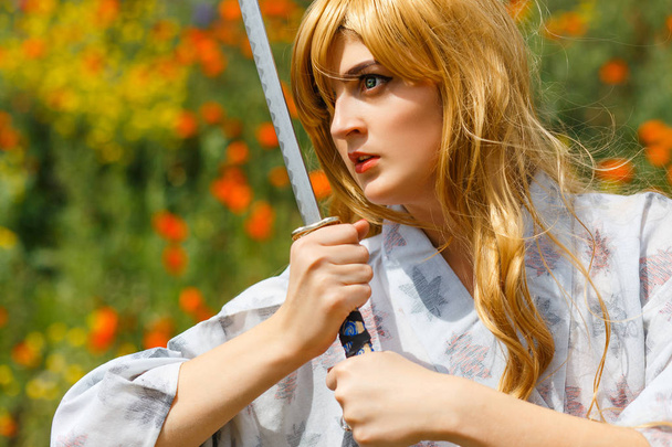 Portrait of Samurai Girl with a sword - Foto, afbeelding