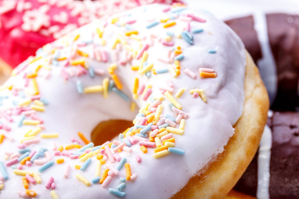 Delicious donuts with sprinkles - Photo, Image