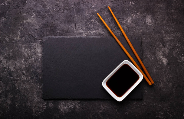 Sushi chopsticks and soy sauce - Fotó, kép