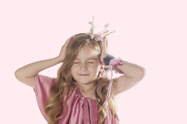 Little princess with closed eyes. Cute girl imagines. Sweet dreams - Photo, Image