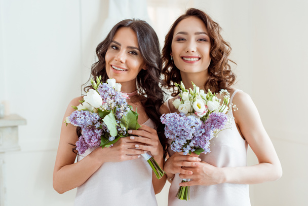 beautiful bridesmaids with bouquets - Foto, imagen