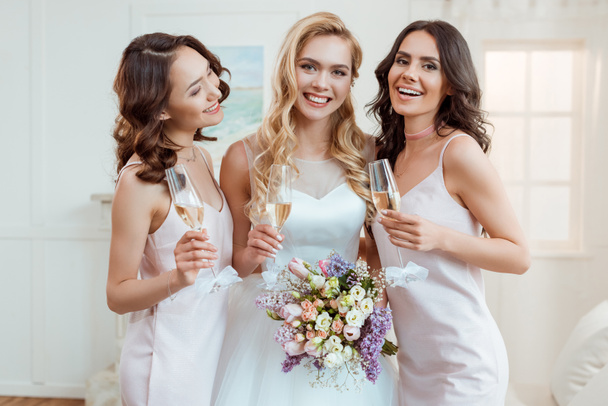 bride with bridesmaids drinking champagne - Photo, Image