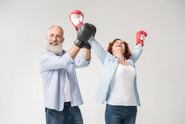 couple triumphing in boxing gloves - Fotó, kép