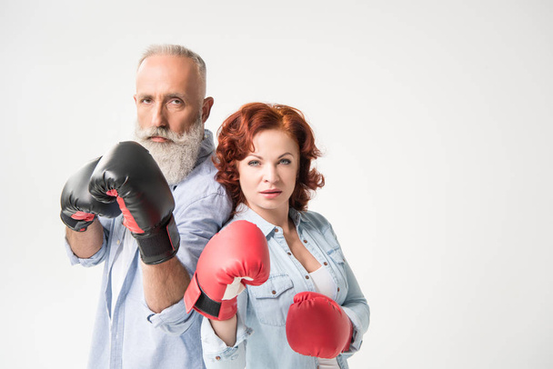 mature couple in boxing gloves - Фото, зображення