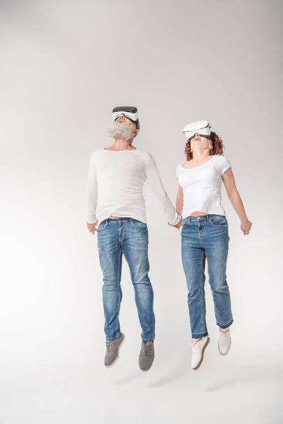 couple using virtual reality headsets - 写真・画像