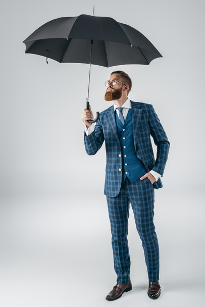 attractive young man with umbrella - Φωτογραφία, εικόνα
