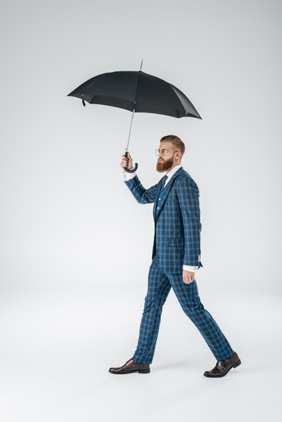 attractive young man with umbrella - Fotoğraf, Görsel