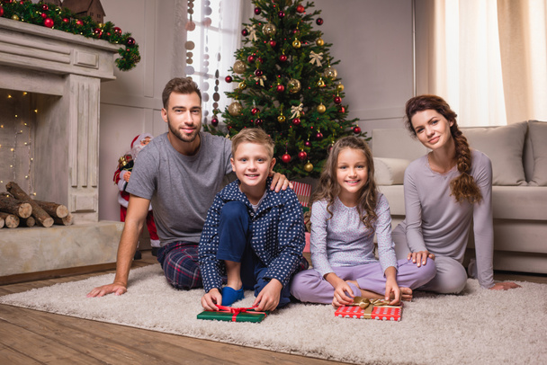 family in pajamas on christmas - Fotografie, Obrázek