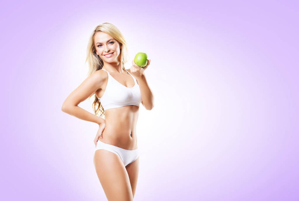 woman in white lingerie with green apple - Photo, image