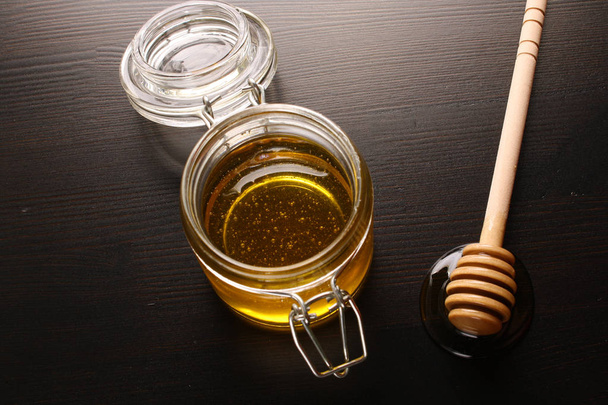 Honey on a wooden background - Photo, image