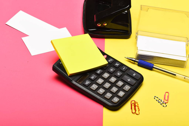 Business and work concept. Business card holder and calculator - Foto, Imagen