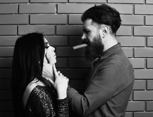 bearded man and pretty sexy woman with cigar - Fotó, kép