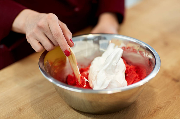 chef making macaron batter at confectionery - Фото, изображение
