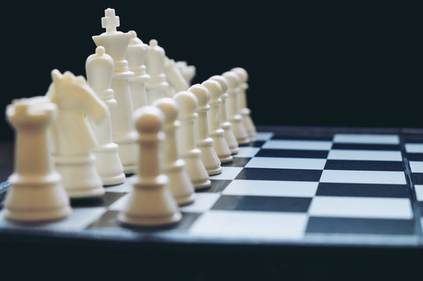 Chess pawns on the chessboard with selective focus - 写真・画像
