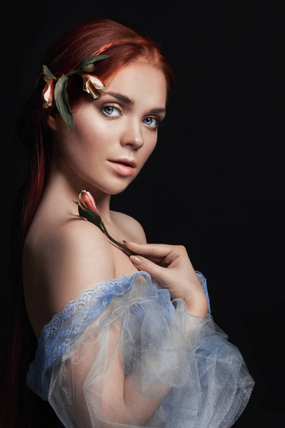 Sexy beautiful redhead girl with long hair in dress cotton retro. Woman portrait on black background. Deep eyes. Natural beauty, clean skin, facial care and hair. Strong and thick hair. Flower. - Φωτογραφία, εικόνα