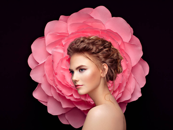Beautiful woman on the background of a large flower - Фото, зображення