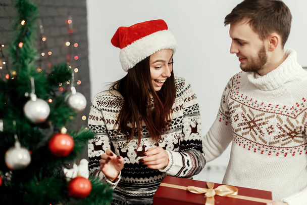 man giving Christmas present to woman - Photo, Image