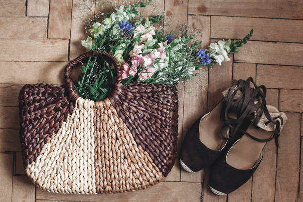 flowers in bag and female shoes - Photo, Image