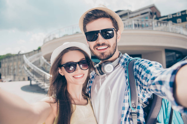 Close up of a cheerful young couple making selfie photo on camer - Фото, изображение