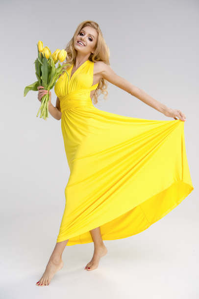 Blonde girl in yellow dress  - Foto, Imagen