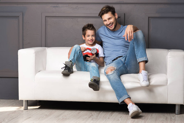 Father and son on couch - Photo, Image