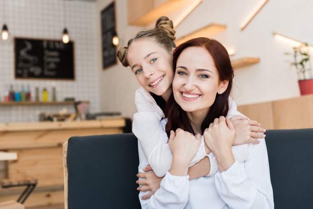 mother and daughter in cafe - Фото, изображение