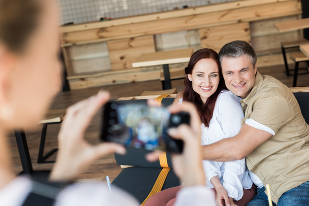 mature couple embracing in cafe - Photo, Image