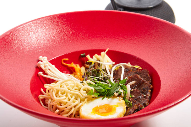 Specialties of Pan-Asian cuisine in red plate - Foto, afbeelding