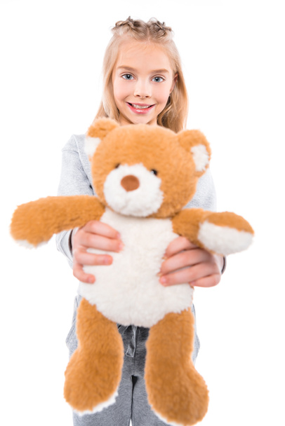 child holding teddy bear - Фото, изображение