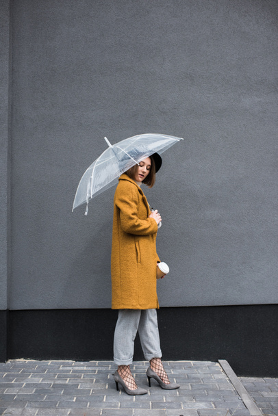 fashionable woman with umbrella - Fotó, kép