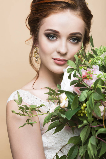 Young pretty bride with wedding bouquet - Fotoğraf, Görsel