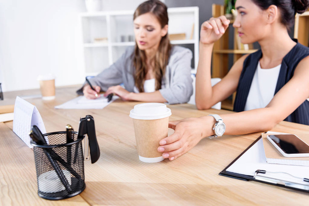 businesswomen with coffee at workplace - Фото, зображення