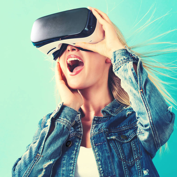 woman using virtual reality headset - Fotó, kép