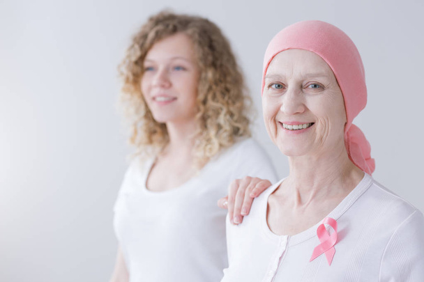 Caring daughter supporting cancer mother - 写真・画像