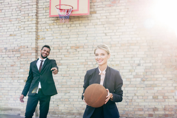 business colleagues with basketball ball - Foto, afbeelding