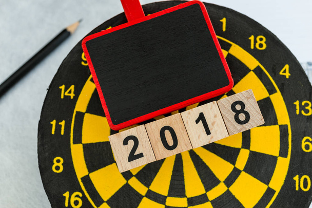 Year 2018 planning target concept with wooden blocks number 2018 - Foto, imagen