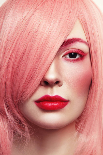 young beautiful woman in pink wig - Фото, зображення
