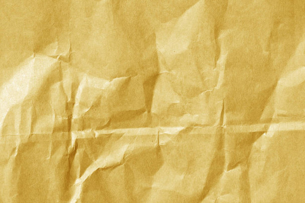 Orange color paper sheet surface with wrinckles.  - Photo, Image
